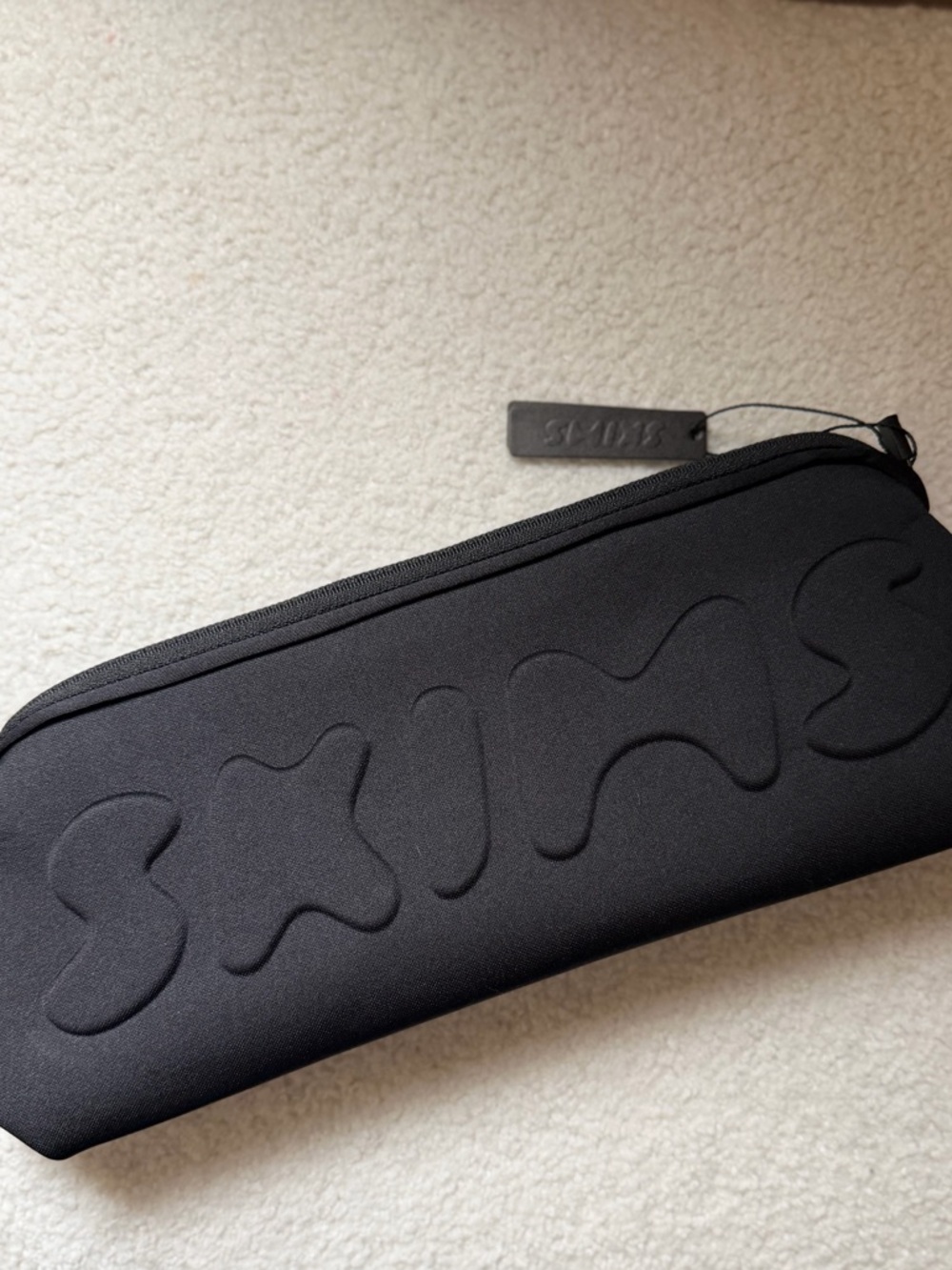 Black SKIMS Neoprene Zip Pouch